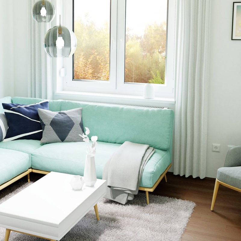 Wohnzimmer mit türkisem Sofa